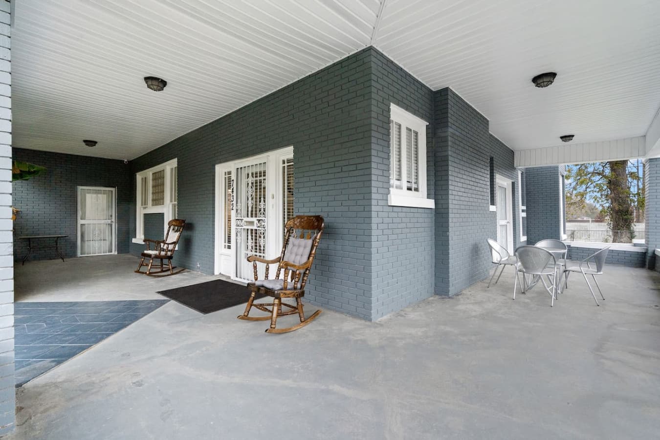 This wraparound porch offers a breezy, peaceful spot for morning coffee or evening chill time.