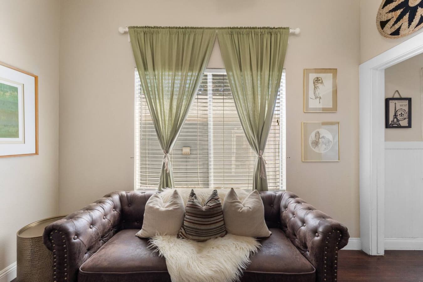 Relax in our cozy couch in the living room with plenty of natural light.