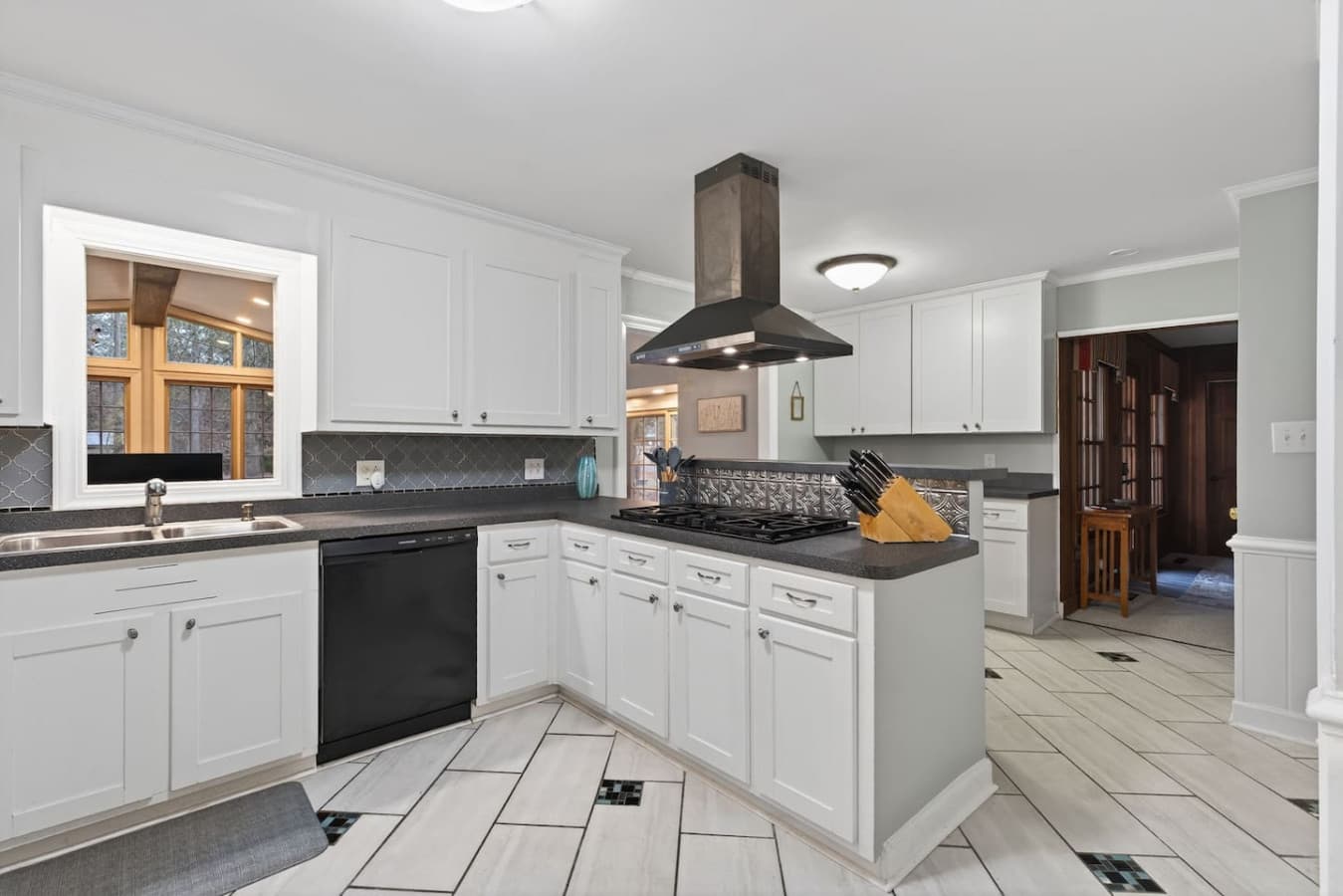 Spacious kitchen equipped with a full-size refrigerator, dishwasher, microwave, stove/oven, blender and coffee maker.