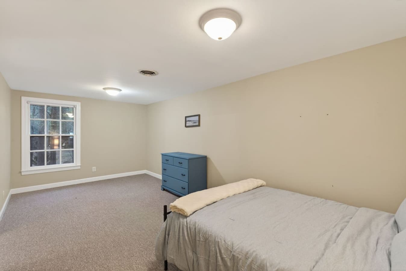 A bright, comfortable room ready for deep rest and easy mornings.