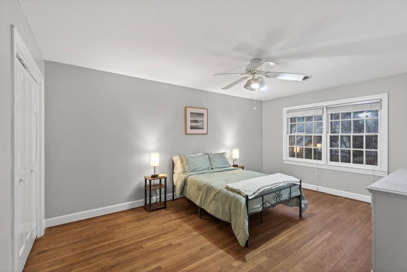 Bright and inviting master suite with a comfortable queen bed, generous walk-in closet, and attached ensuite bathroom for added privacy.