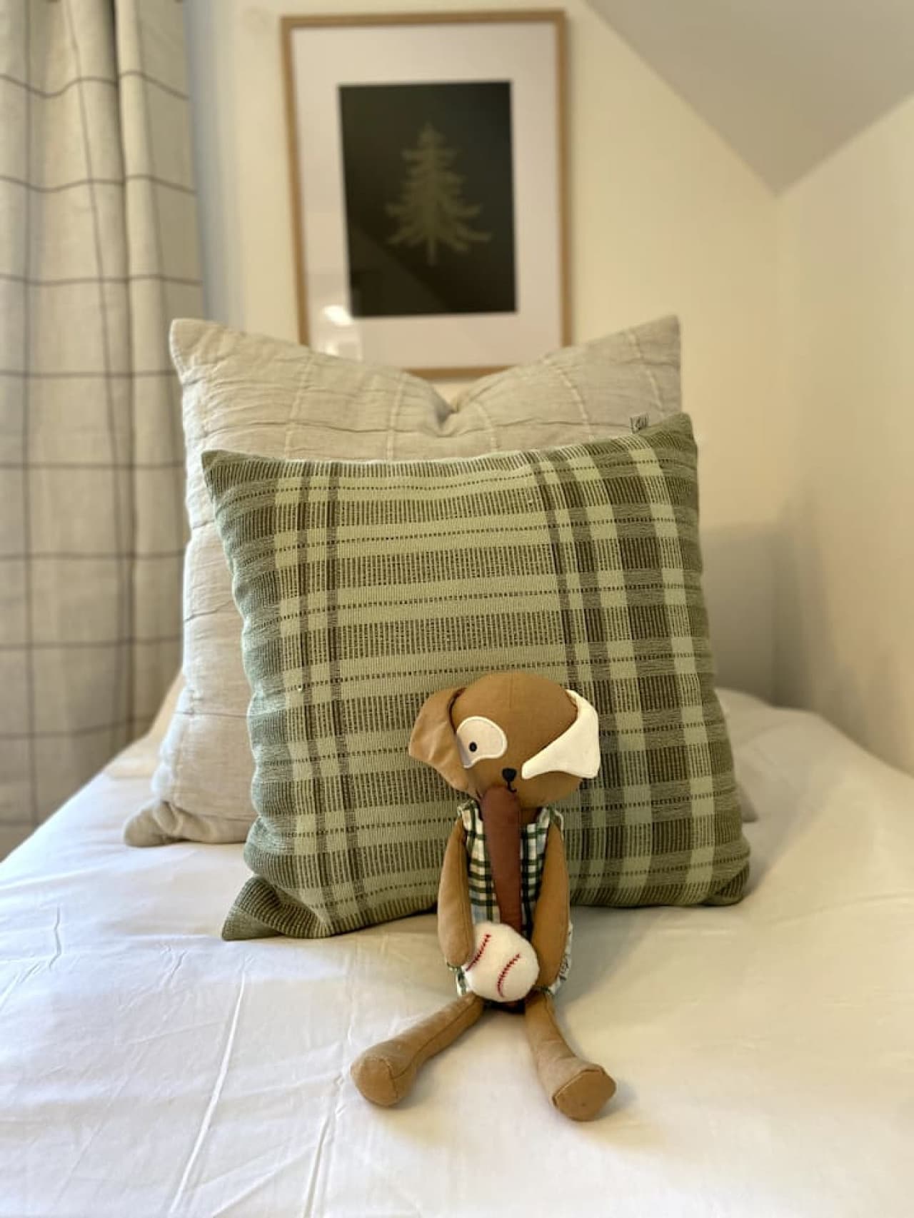 Two single beds, each topped with a soft stuffed toy to welcome little guests (and the young at heart).