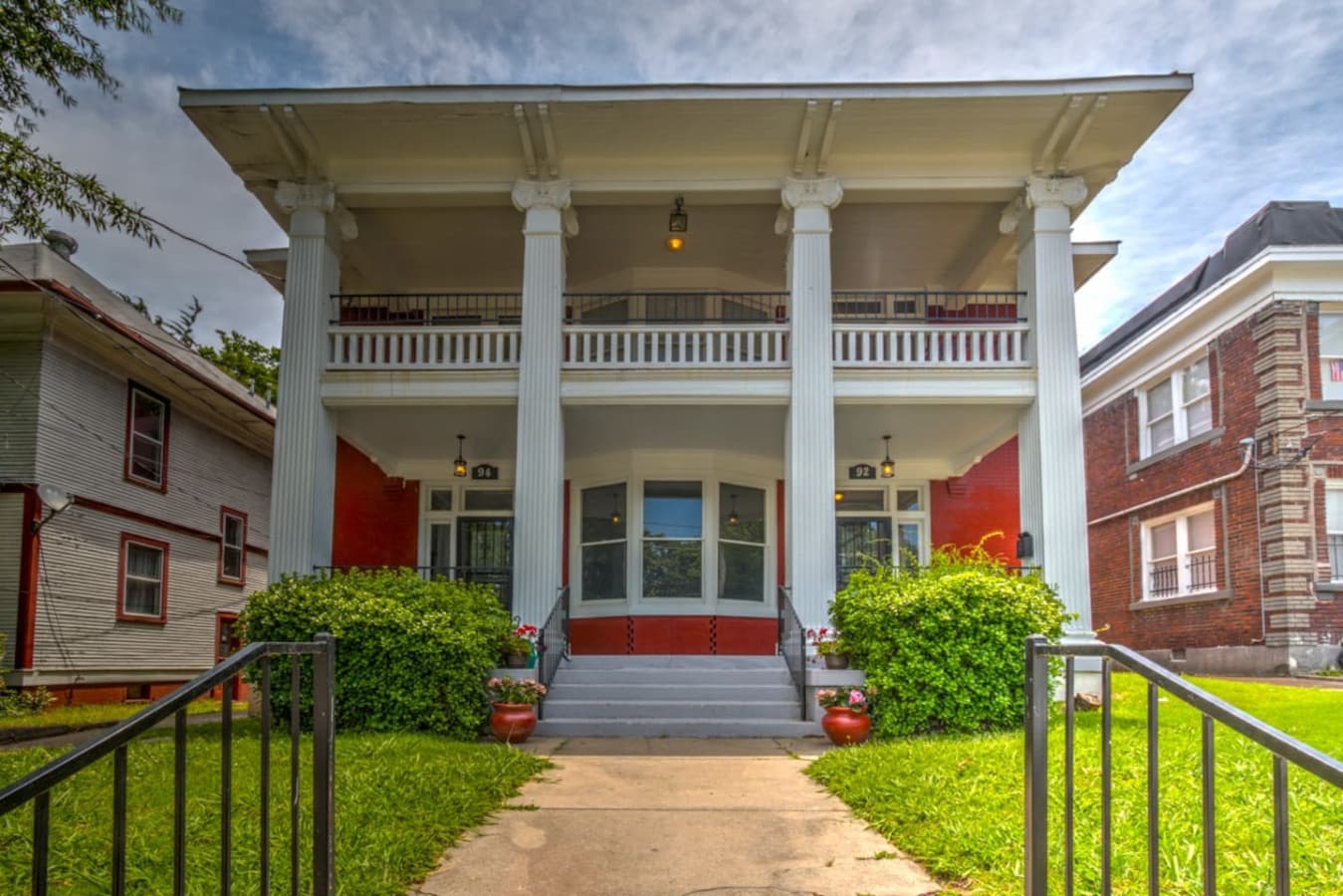 Street view of the building — your apartment is downstairs with the left entry door.