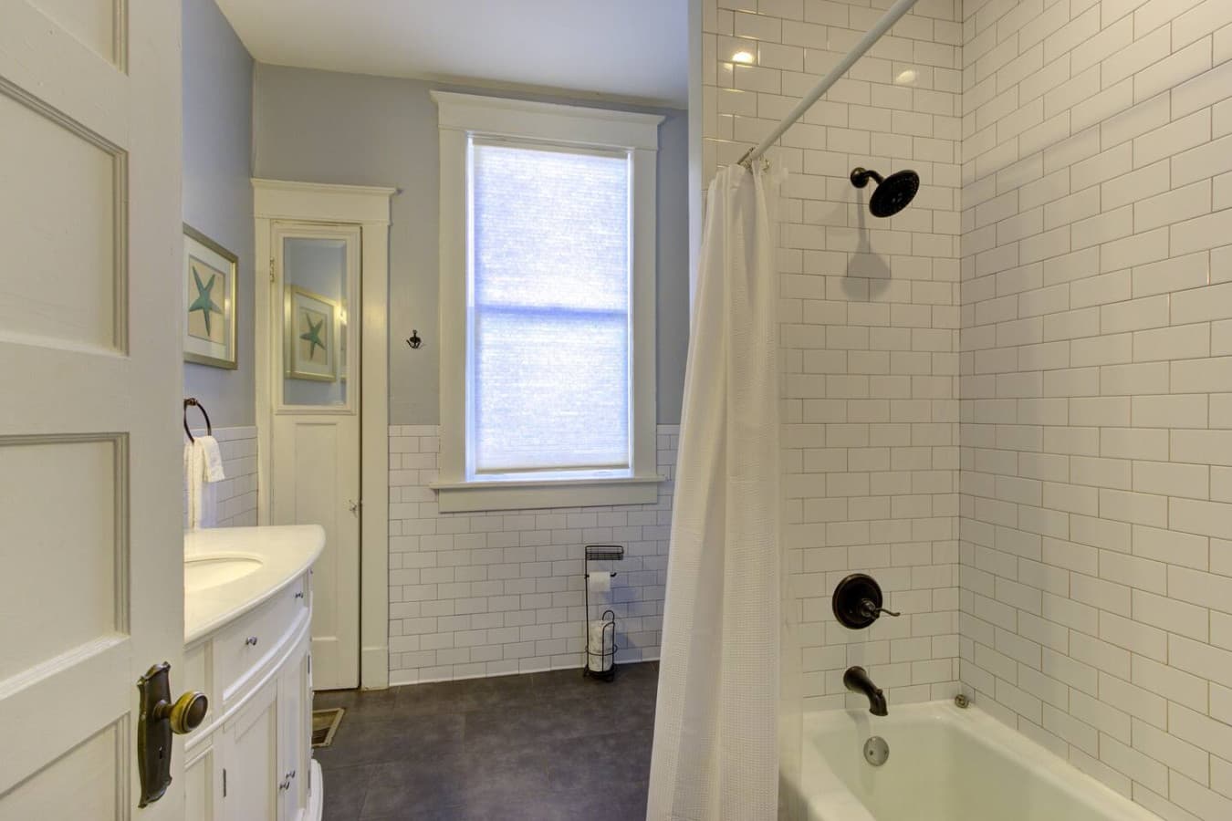 Full bathroom with a full-size tub and shower.