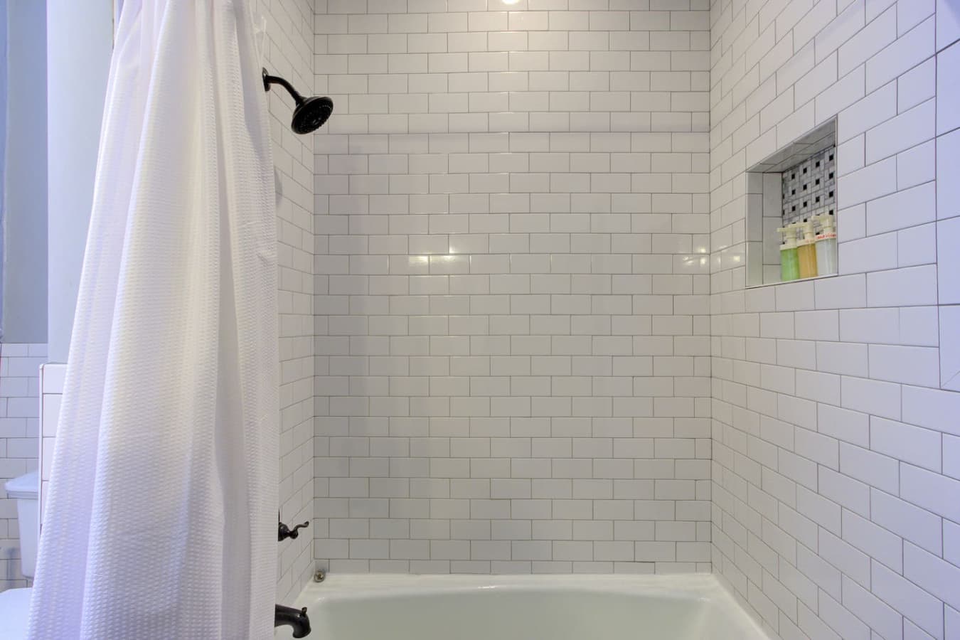 Full bathroom with a full-size tub and shower.