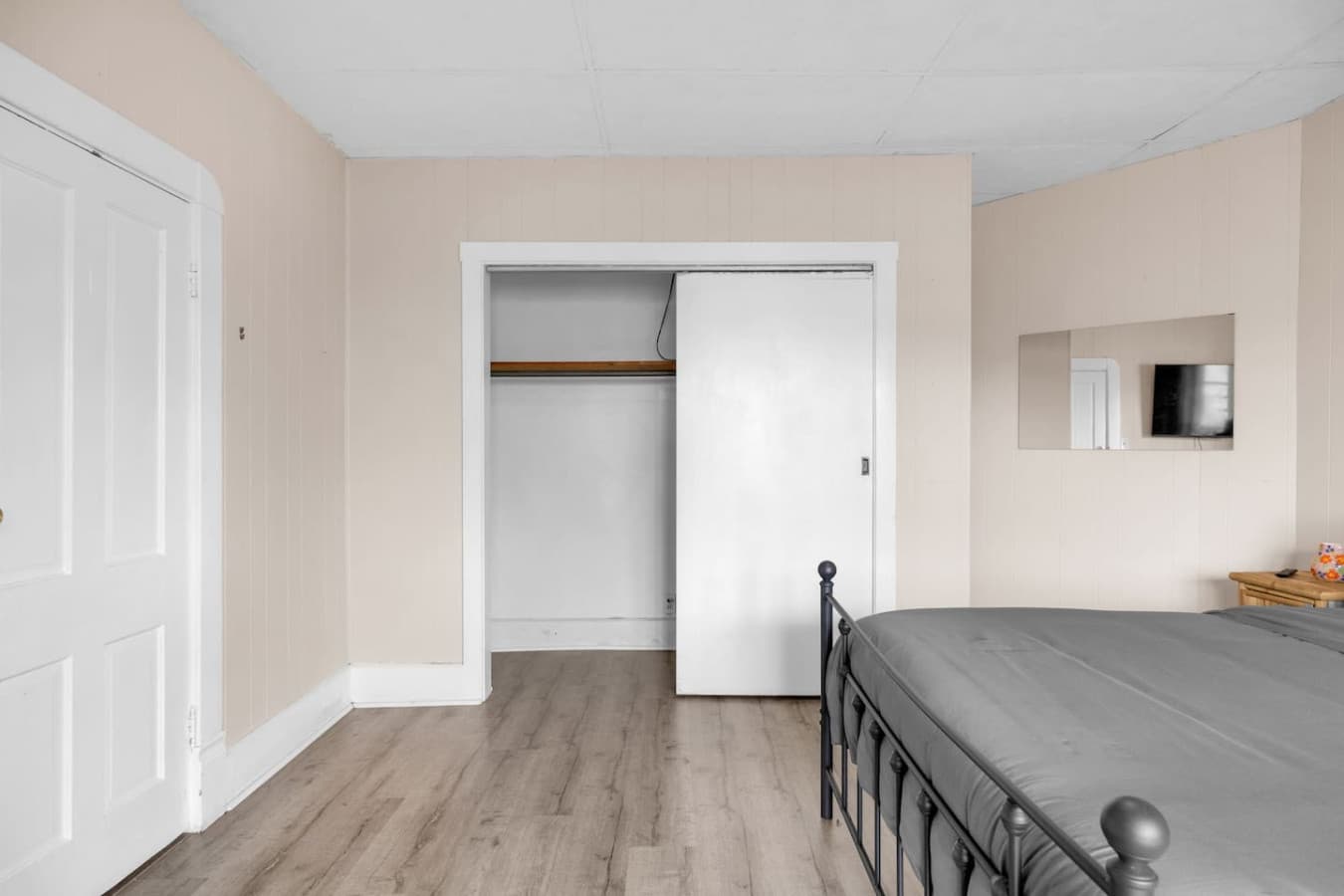A queen bed with a closet that knows your secrets.