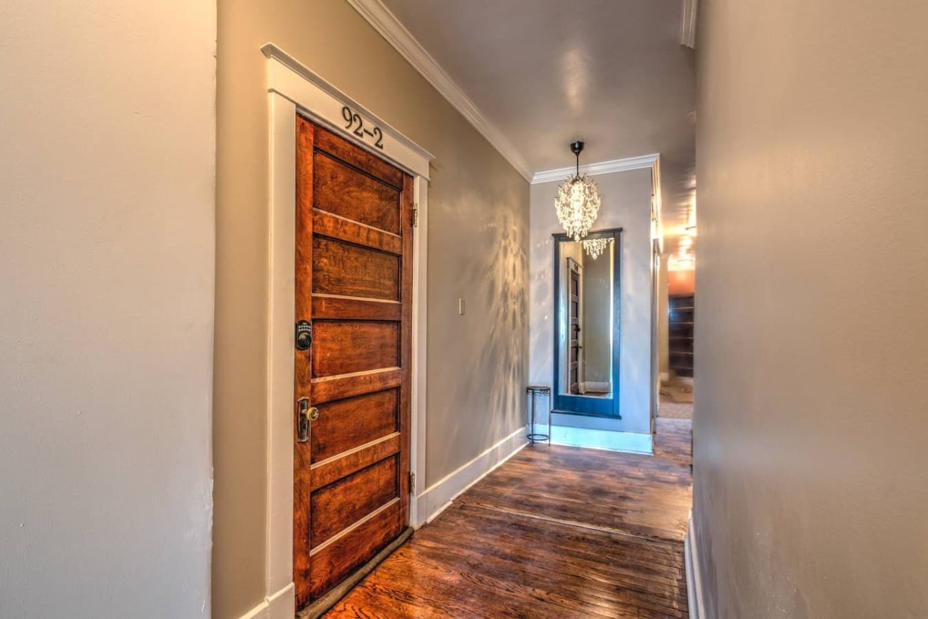 The front door to your apartment is located just up the stairs to the left.
