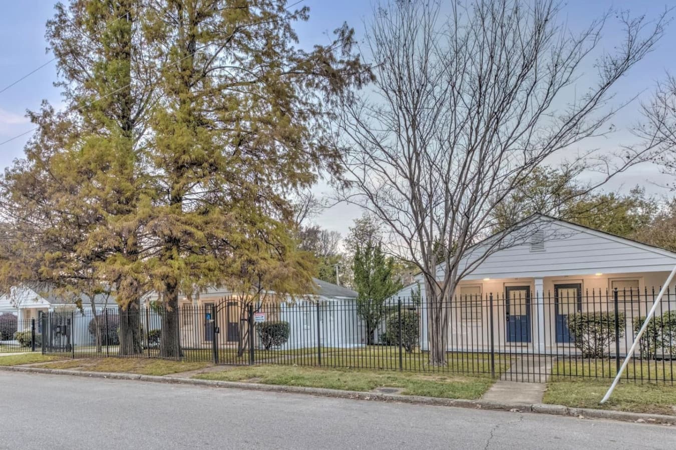 Gorgeous street view of the gated community and it's blue entrance doors.