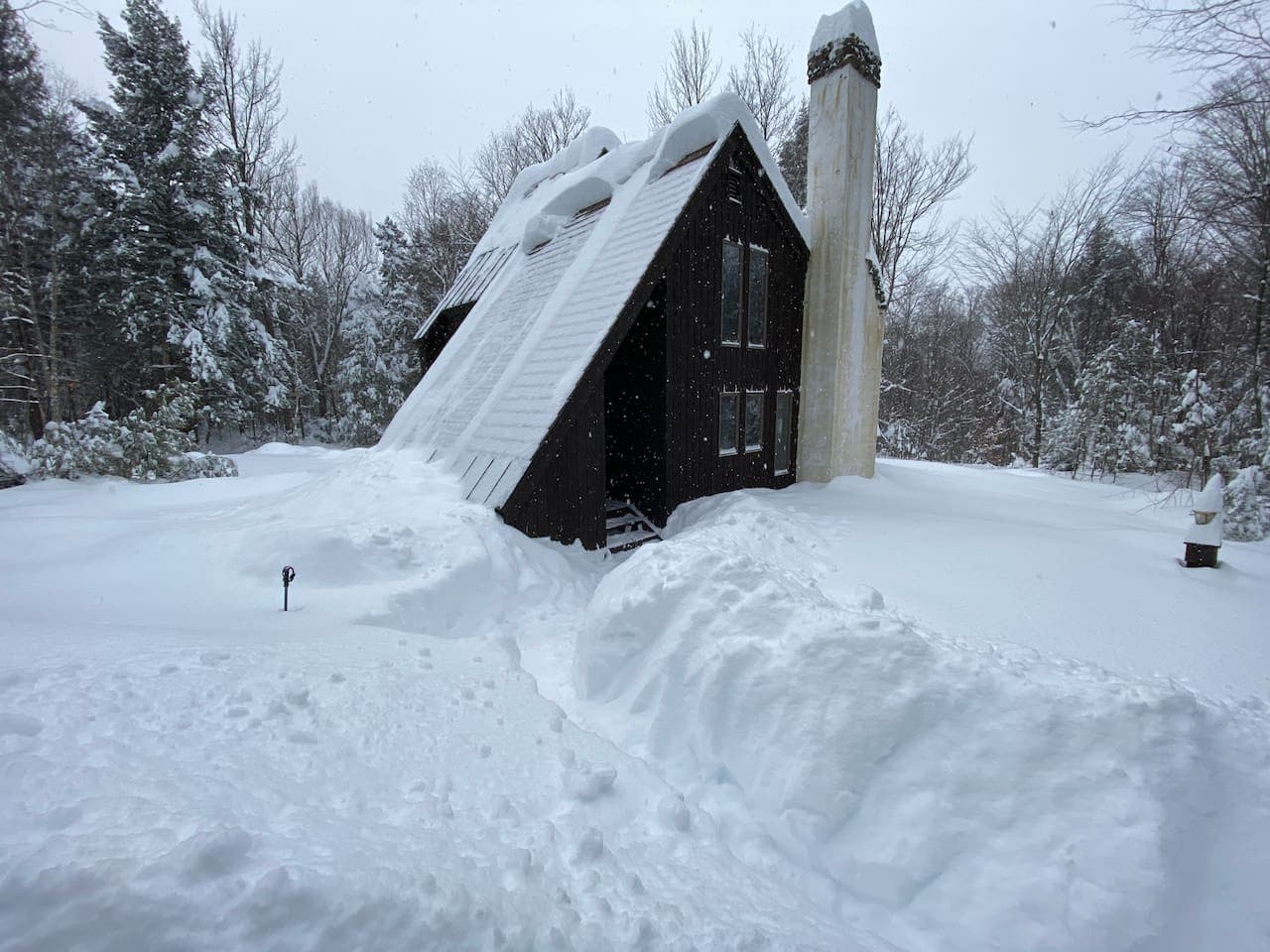 An A-frame so iconic, it might just make you want to build a snowman on the front porch.