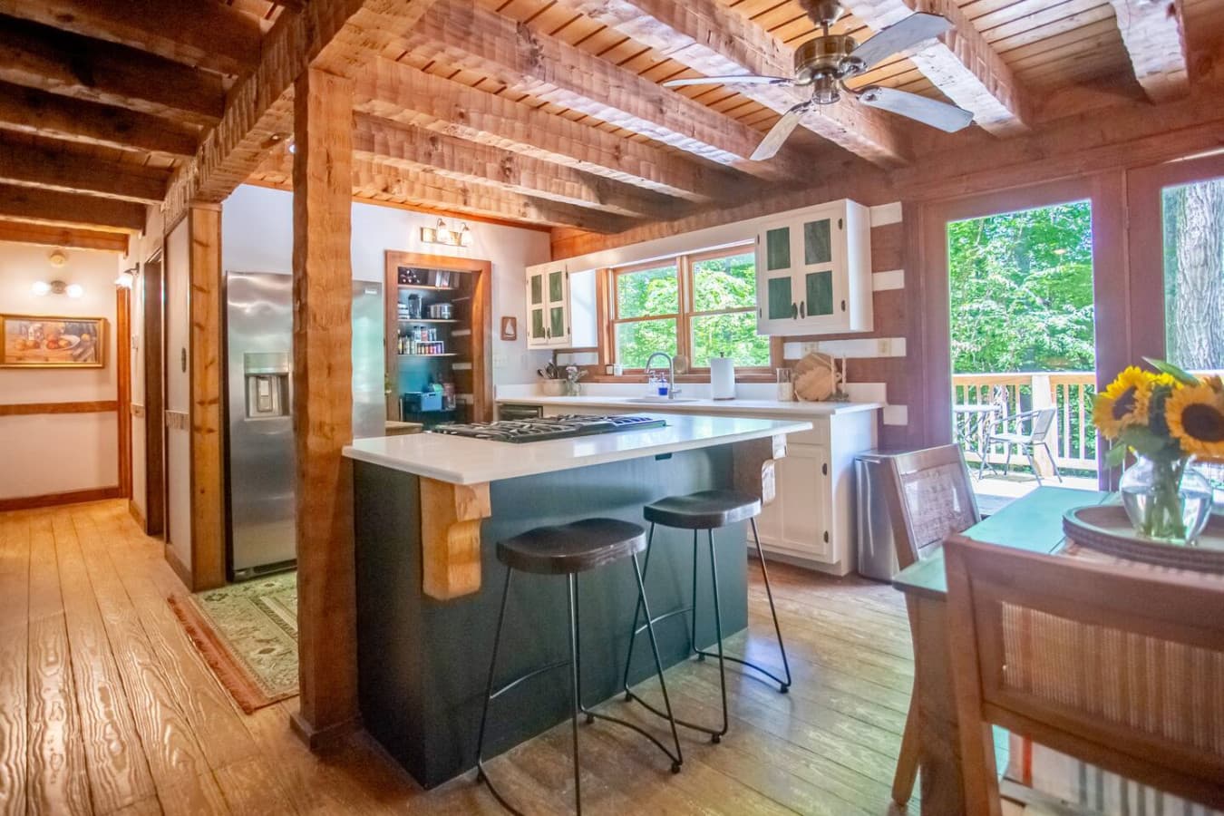 Cabin on the Haw: From stove to stools, this kitchen island keeps everyone connected.