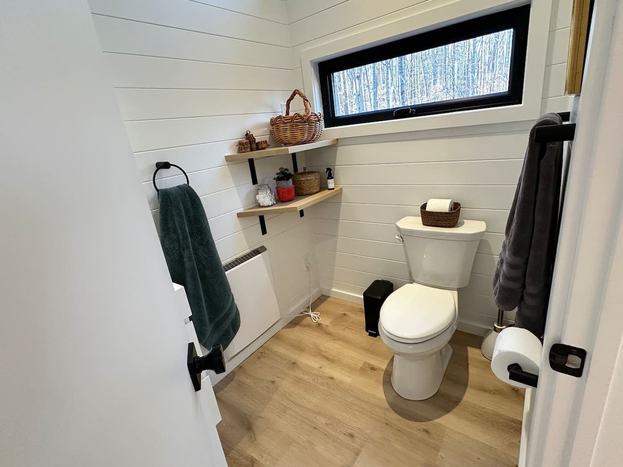 Luna Studio: Refresh and recharge in this spa-like bathroom, complete with a tiled shower and stylish modern fixtures.