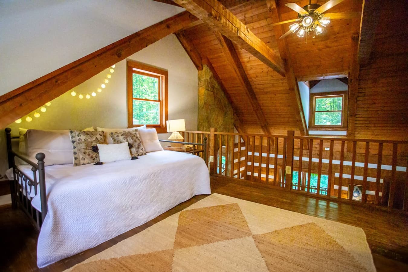 Cabin on the Haw: The loft offers flexible sleeping space with a queen bed and a second queen that slides out when needed.