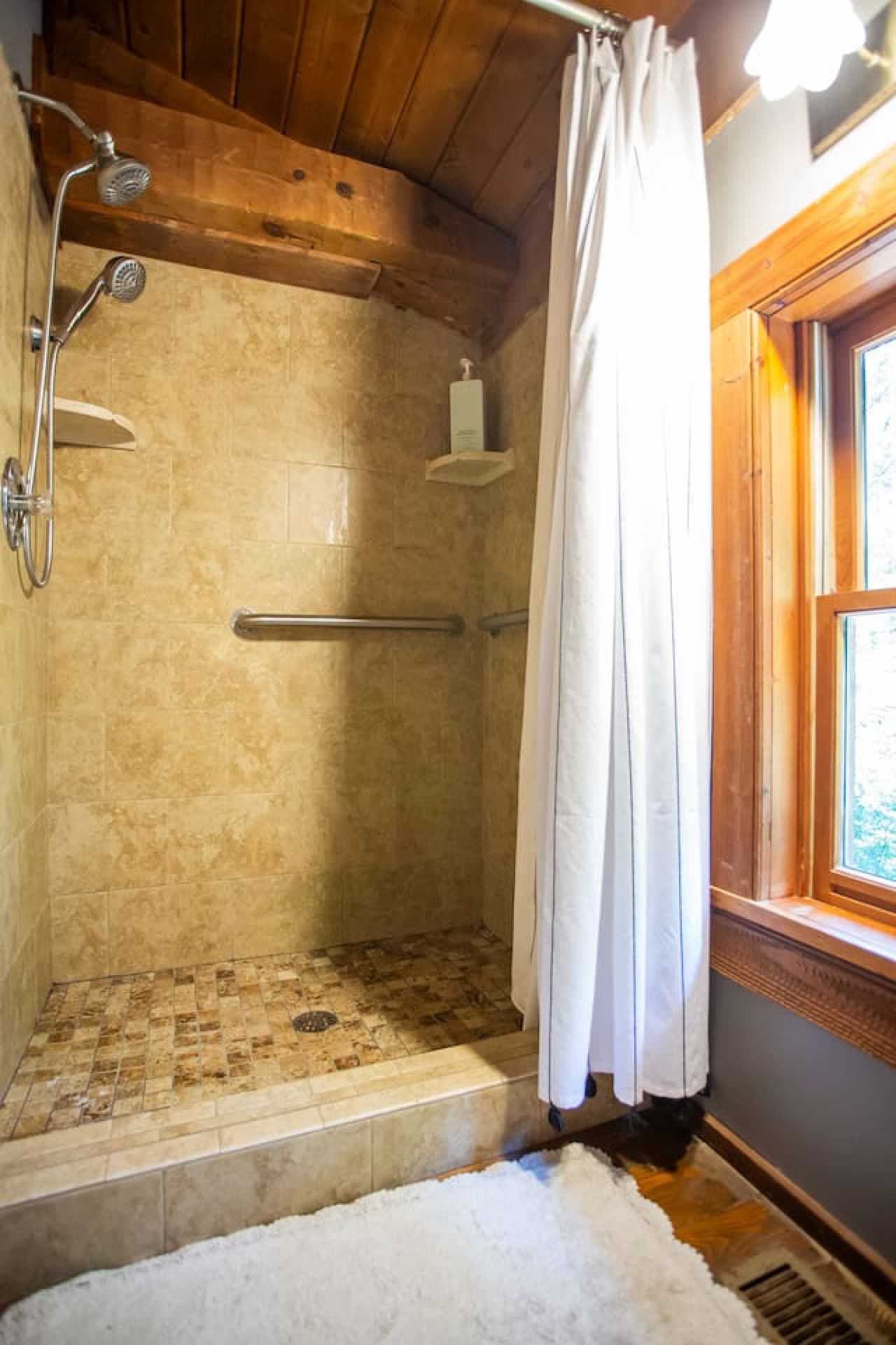 Cabin on the Haw: Step into a warm, wood-toned shower that feels like a cabin spa retreat.