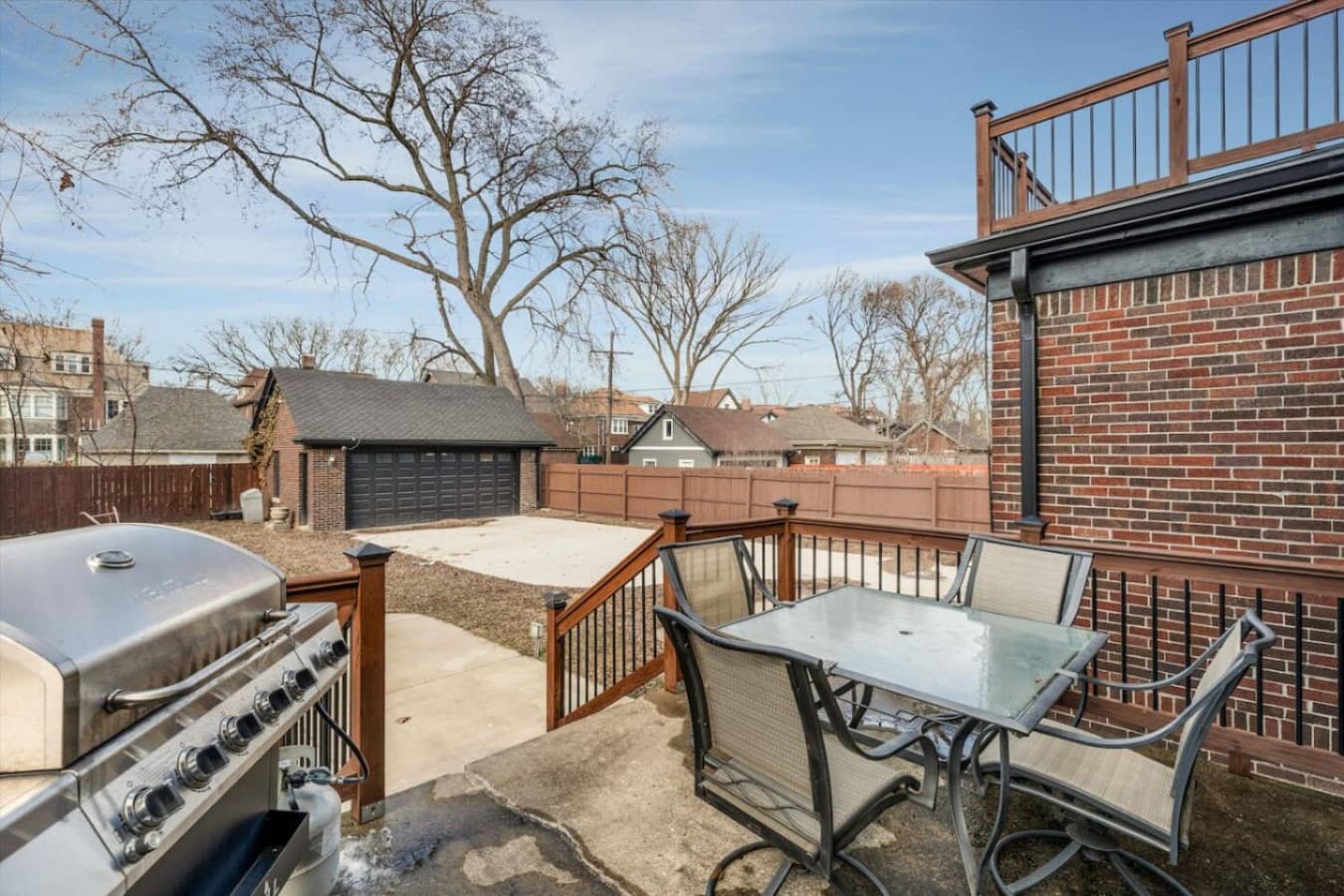 Relax and dine al fresco on the spacious back patio, complete with a BBQ grill and comfortable seating.
