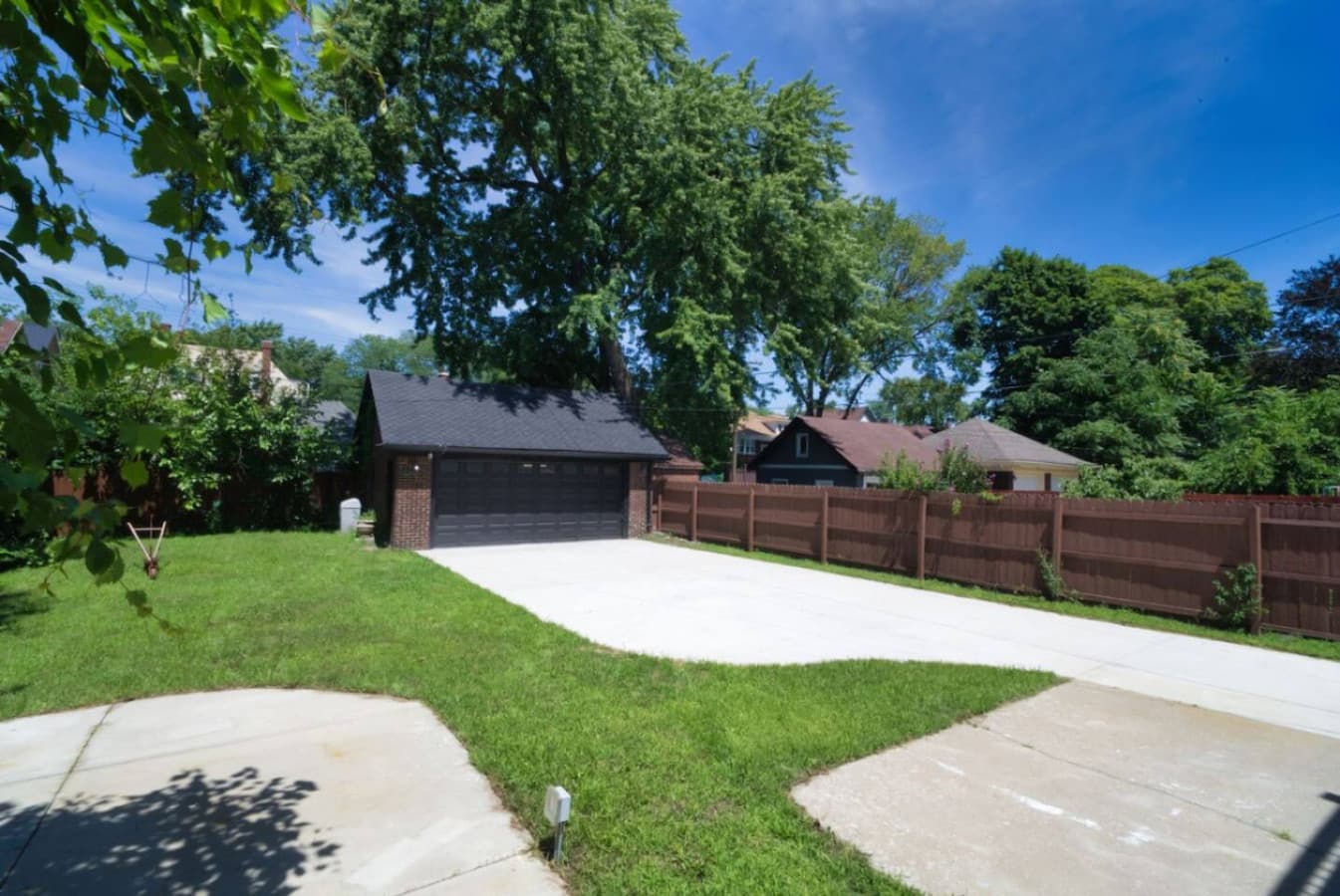A spacious backyard with room to relax, play, and park—ideal for families or groups.