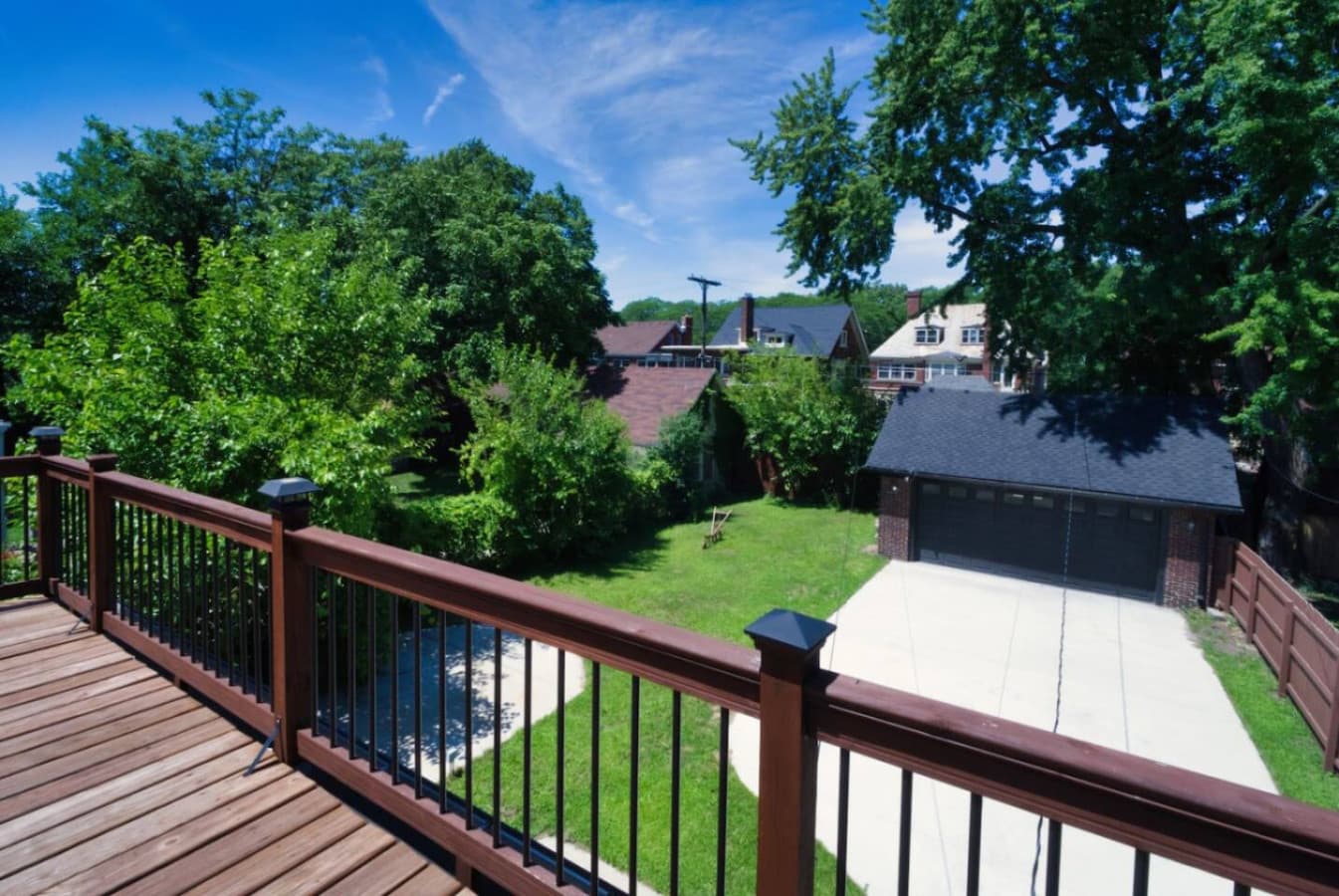 A serene balcony view overlooking the green backyard—perfect for morning coffee or evening relaxation.