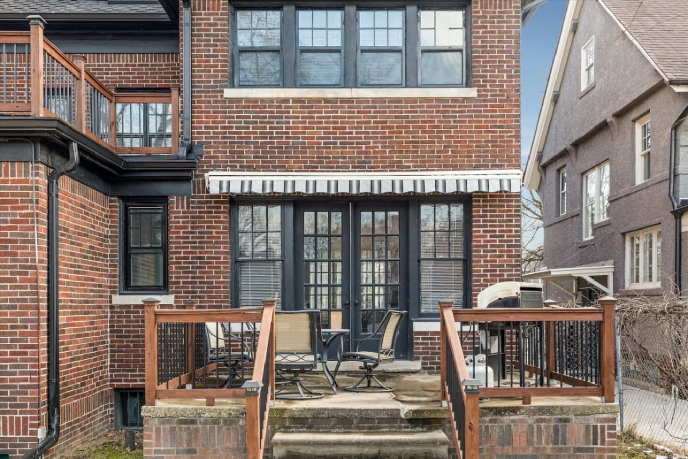 Enjoy a meal or unwind outdoors with the perfect setup—BBQ grill, seating, and a charming table for gatherings.