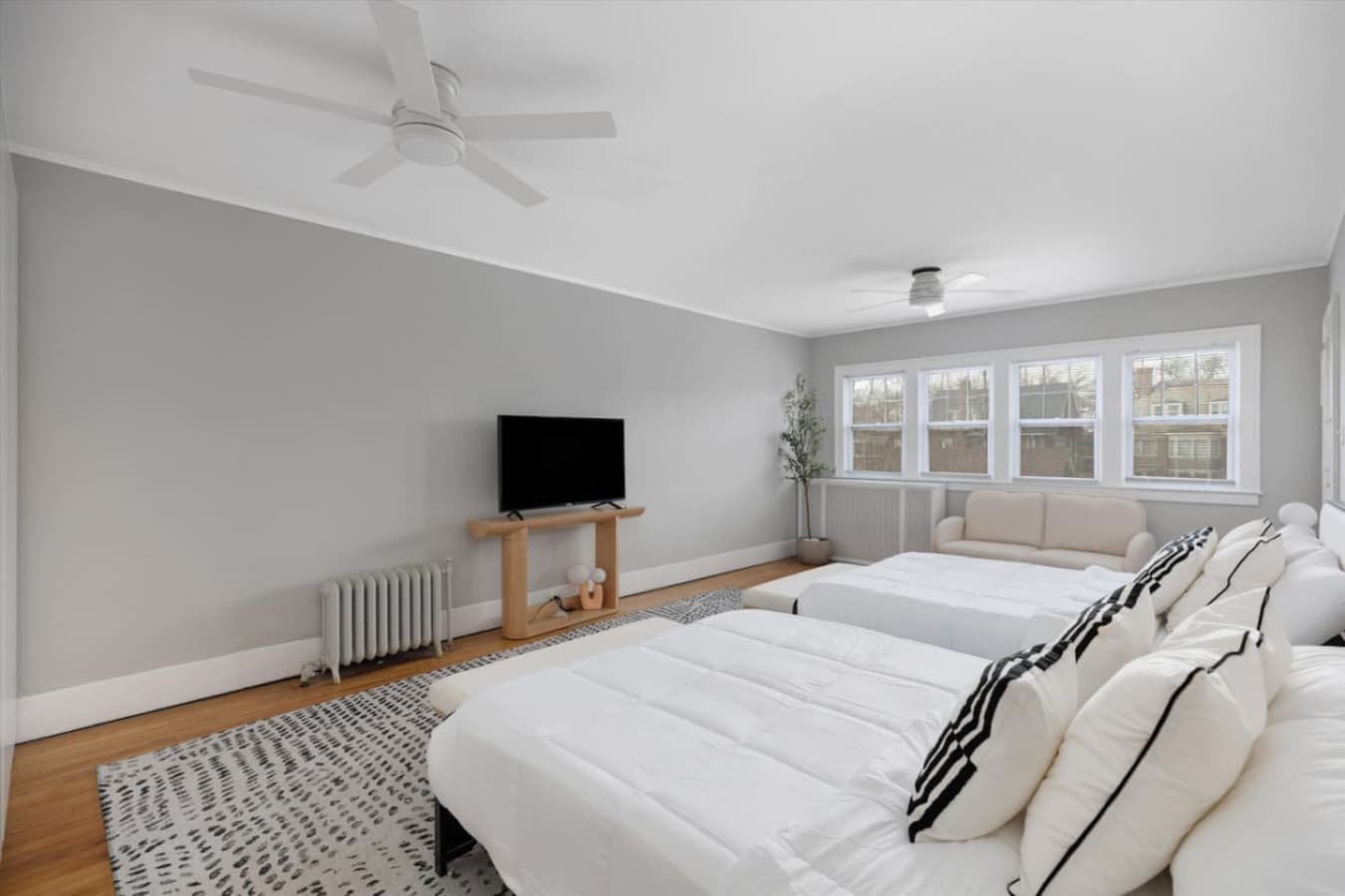 A spacious, light-filled room with two queen beds and a smart TV for all your entertainment needs.