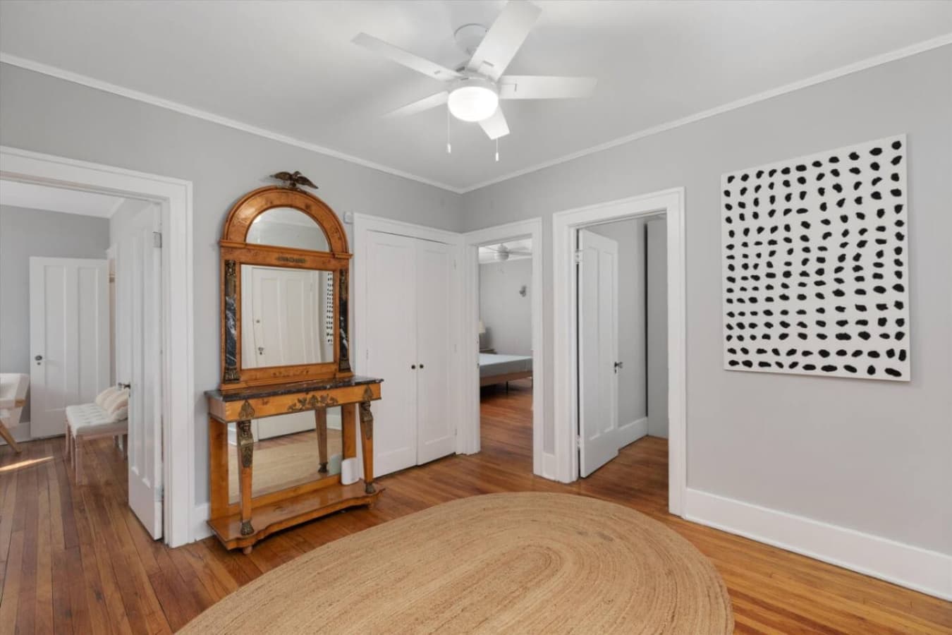 Check your look, straighten your hair, or admire the décor—this hallway’s mirror has you covered.