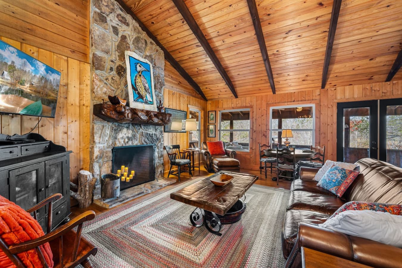 Cozy living room with a Smart TV and a dining table for four.