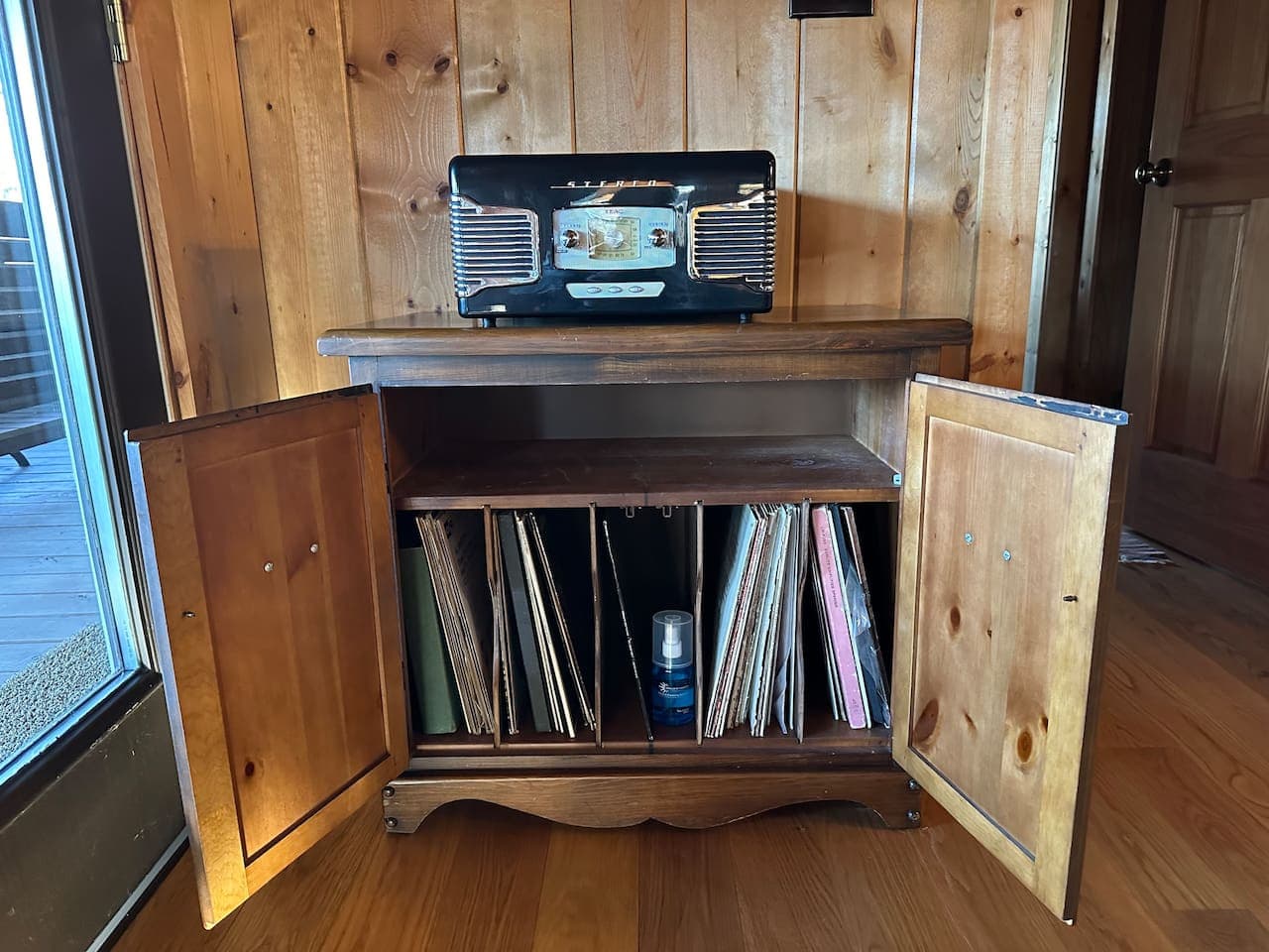 A record player and a selection of records for your listening enjoyment.