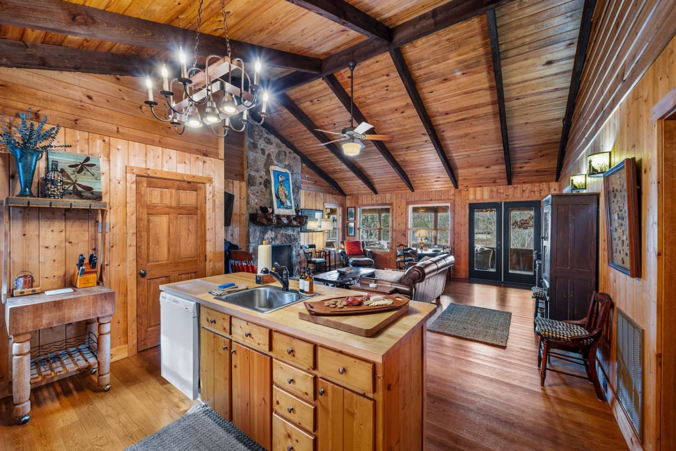 Kitchen island with sink and dishwasher, plus dish soap and detergent provided.