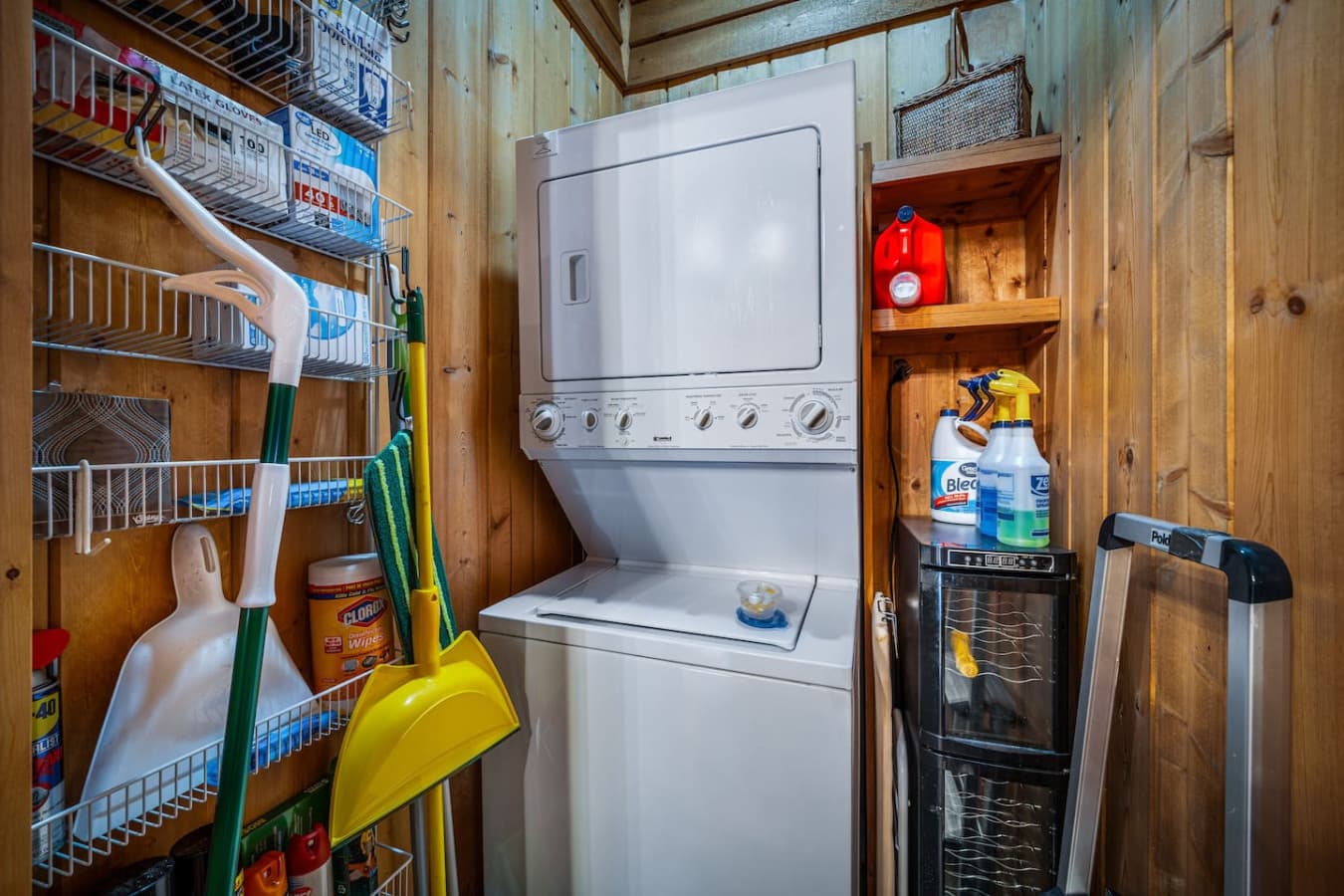 Laundry closet off the kitchen with a few laundry pods provided for guests.