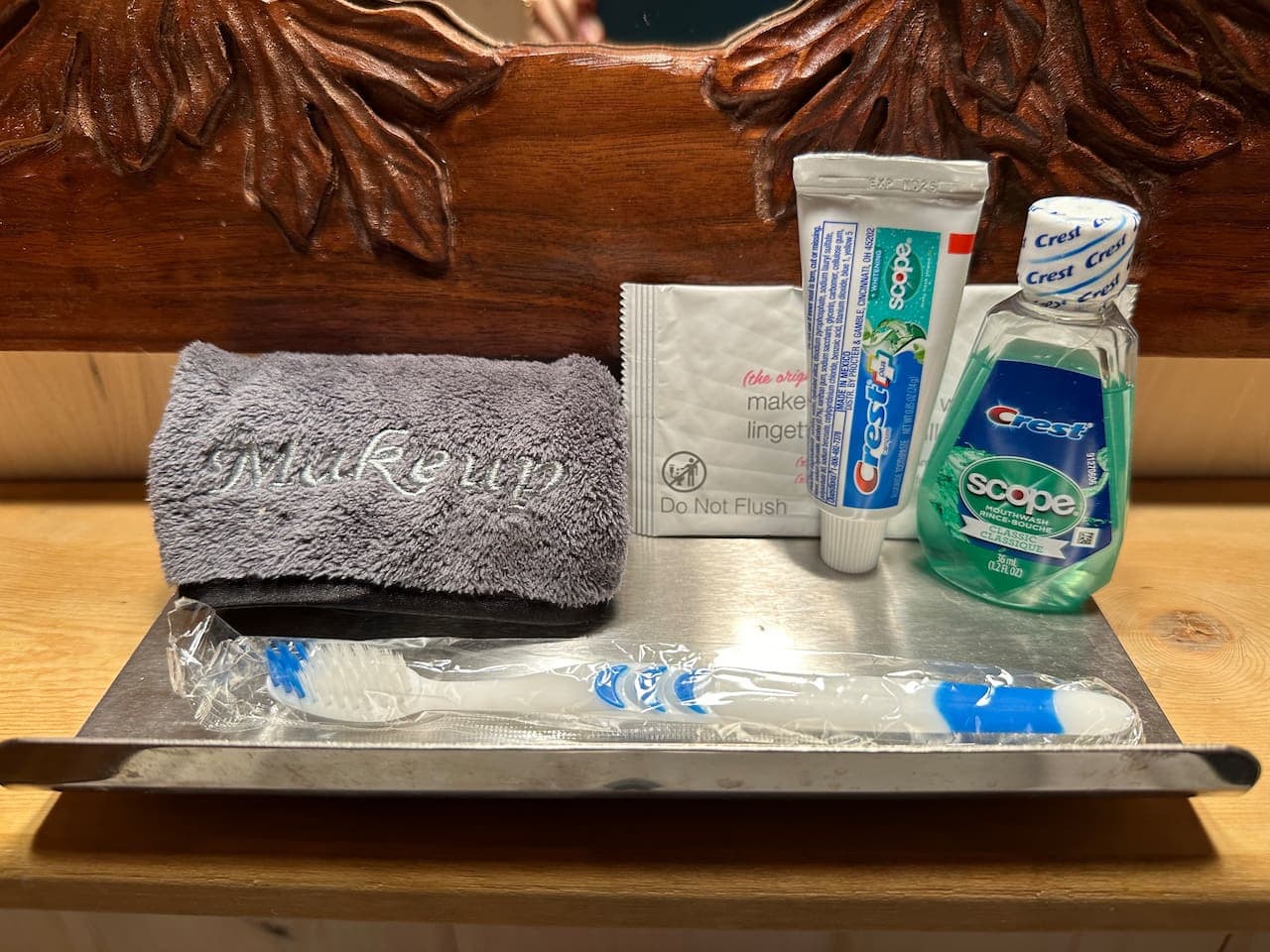 "Forgot Me Tray" with makeup cloth, toothpaste, mouthwash, and toothbrush.