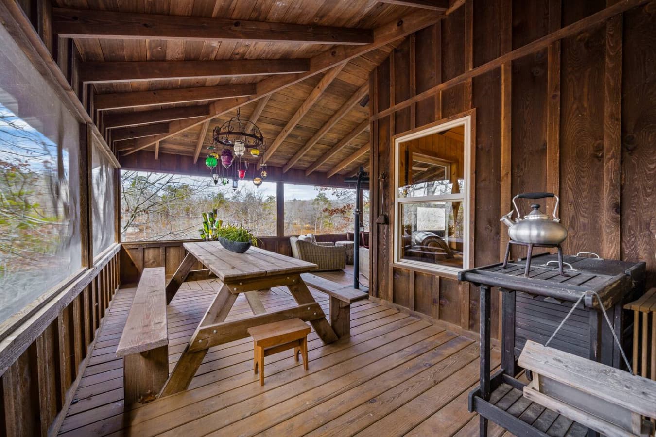 Picnic table on the back porch, perfect for outdoor meals.