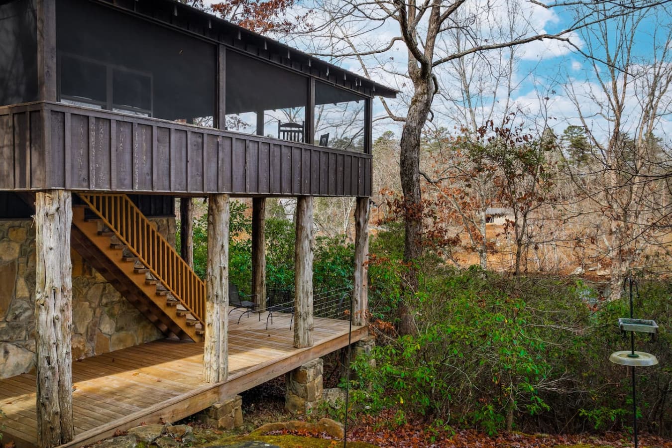 Double wrap-around deck/porch with stairs leading from the downstairs deck (where Bedroom 3 is located) to the main part of the home.