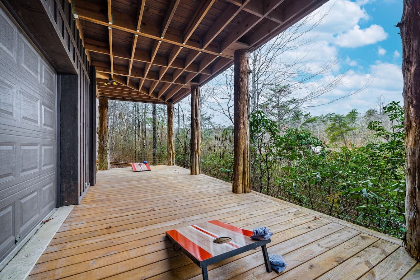 Space for playing cornhole on the lower porch.