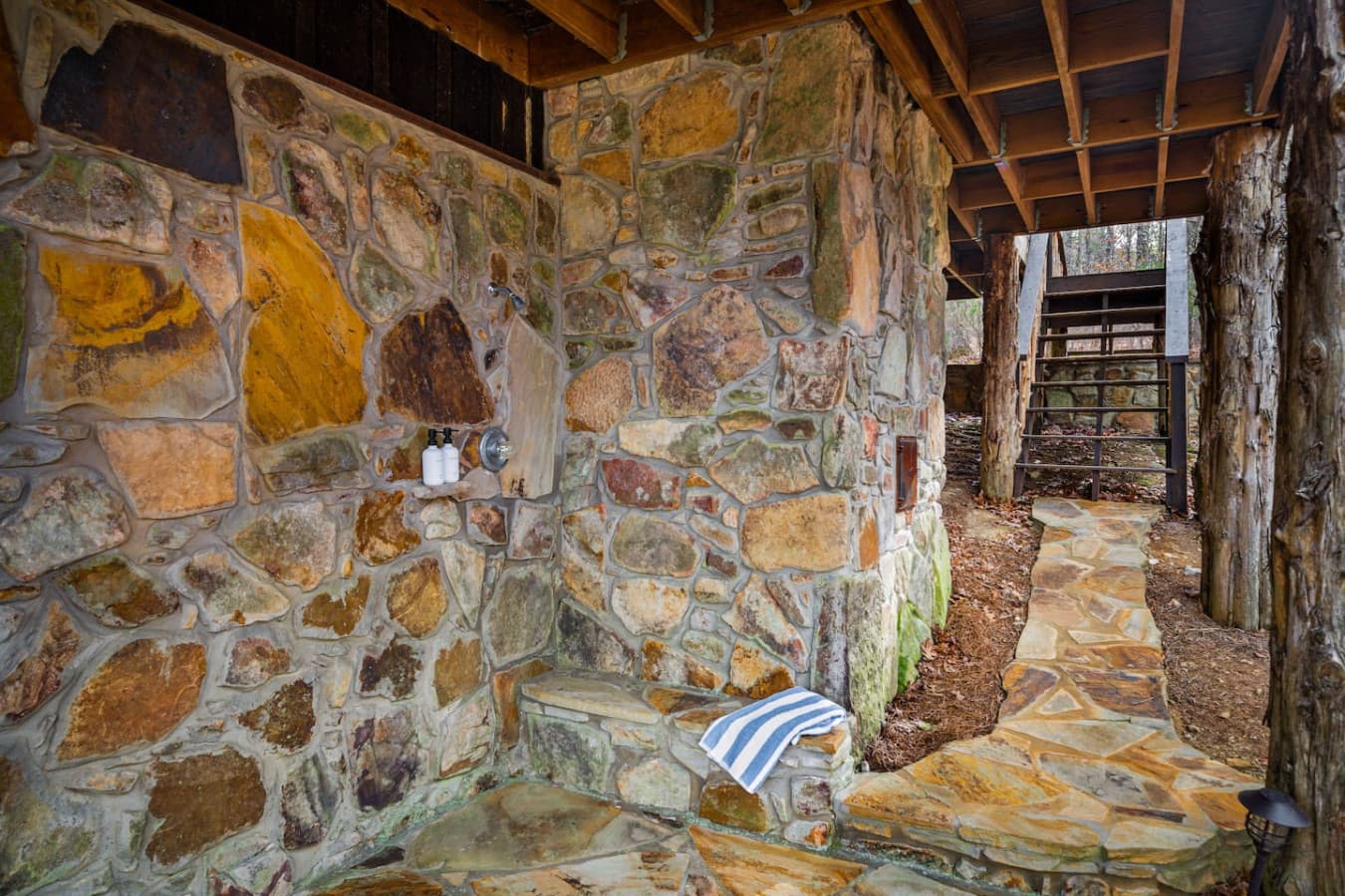Outdoor rock shower for a refreshing experience in nature.