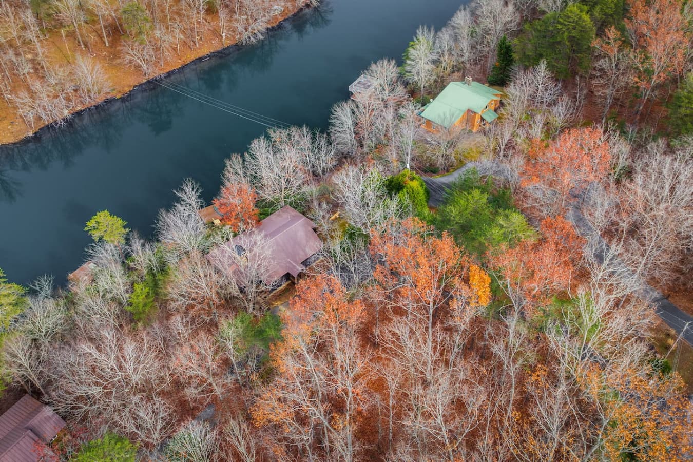 The brown roof of Lahusage Landing, located on the banks of the Little River/Lake Lahusage.