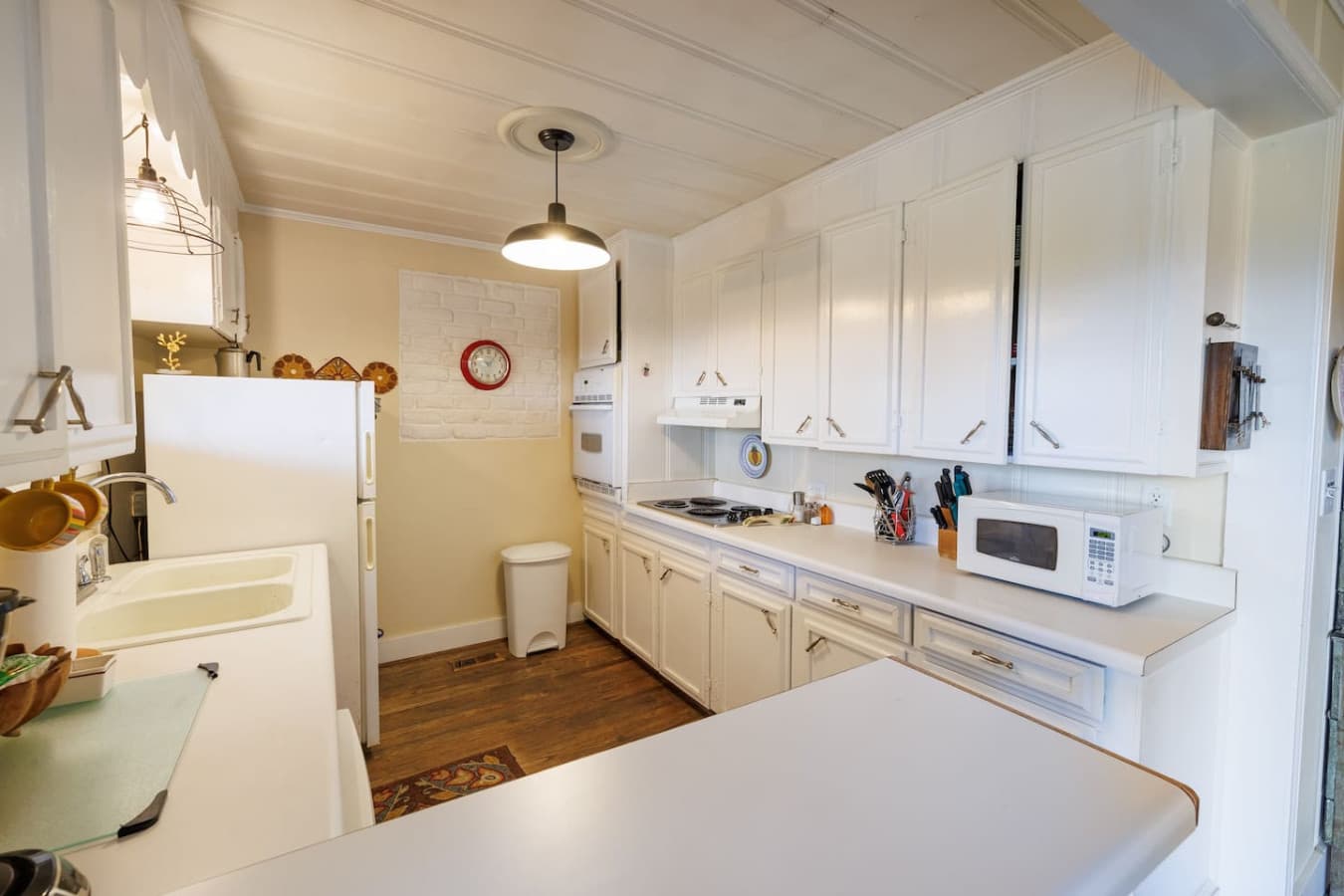 A bright white kitchen stocked with all the essentials.