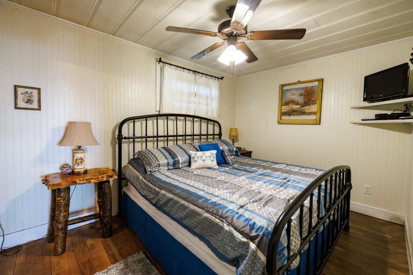 Relax in the comfortable master suite with a king bed featuring a private half bathroom.