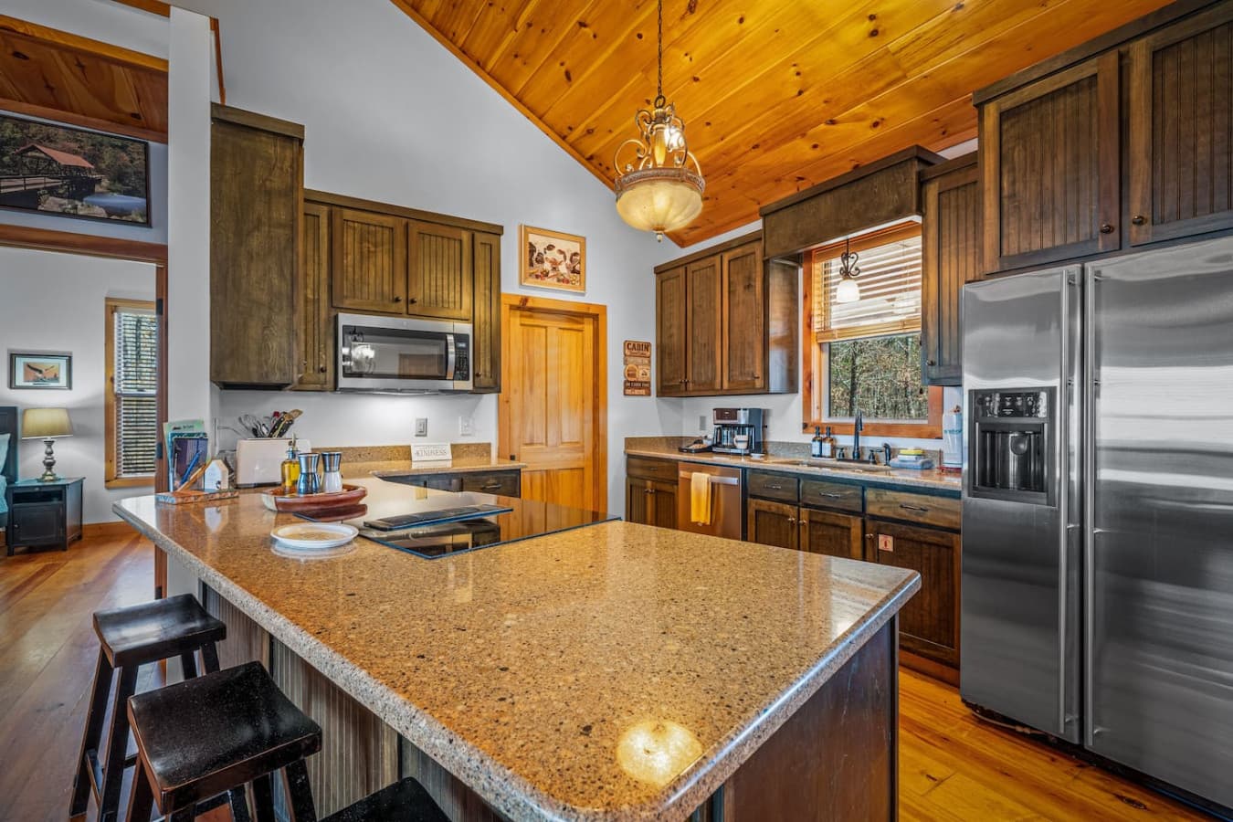 Cook with a view — this well-equipped kitchen offers everything you need, with the stovetop perfectly placed to overlook the stunning scenery beyond.