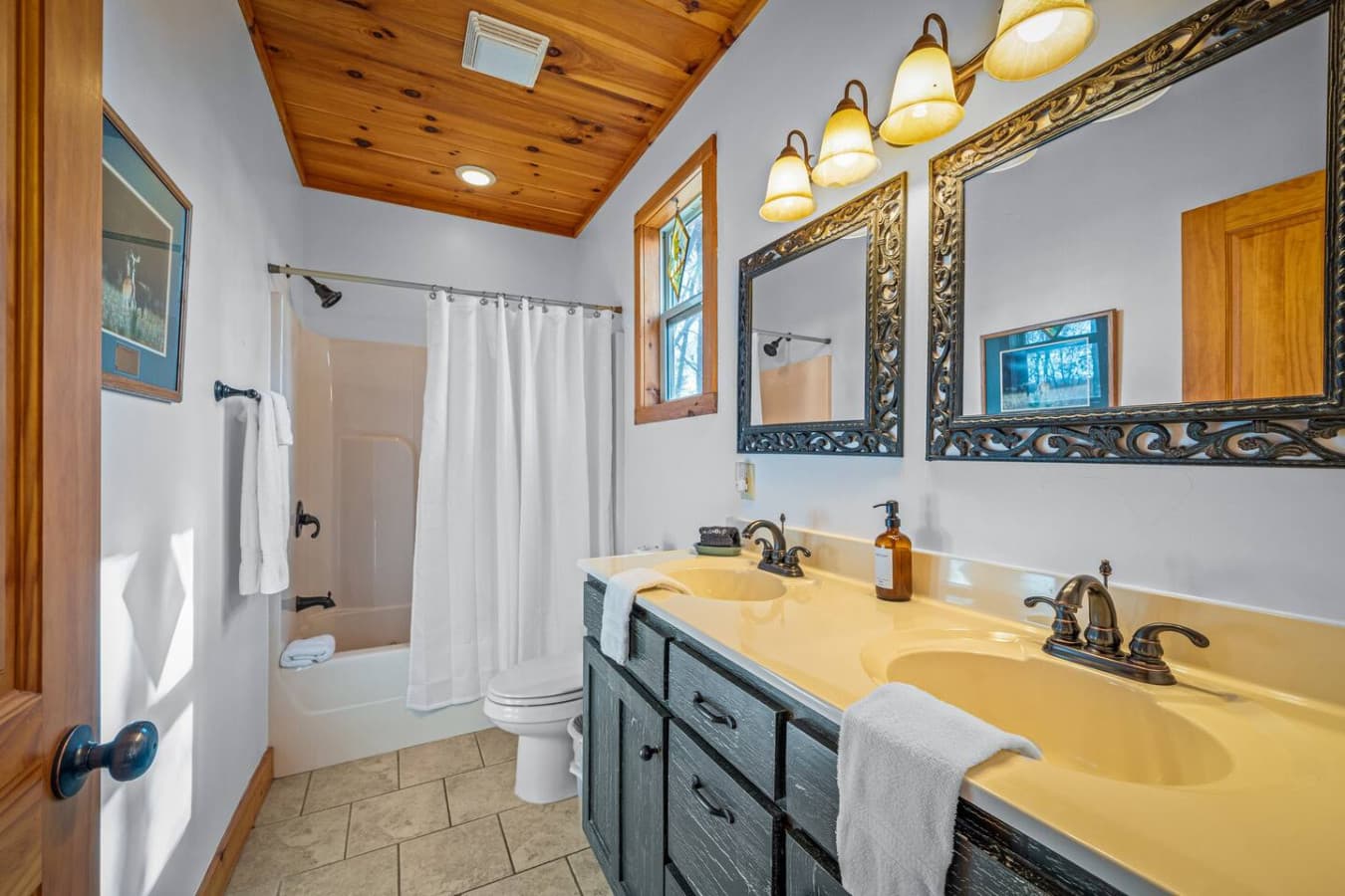 Thoughtfully designed with rustic elegance, this bathroom offers a walk-in glass shower, warm natural tones, and a peaceful ambiance that invites you to slow down and unwind.