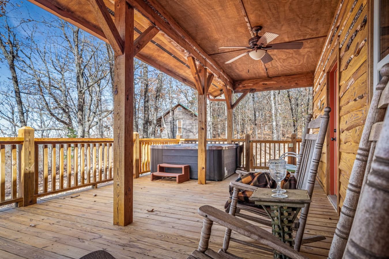 Covered back porch with hot tub overlooking the valley and mountain views.