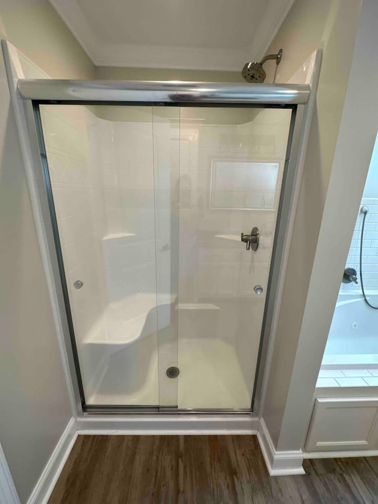 Modern bath with a luxurious tub, glass shower, and sleek vanity—offering comfort and style in every detail.