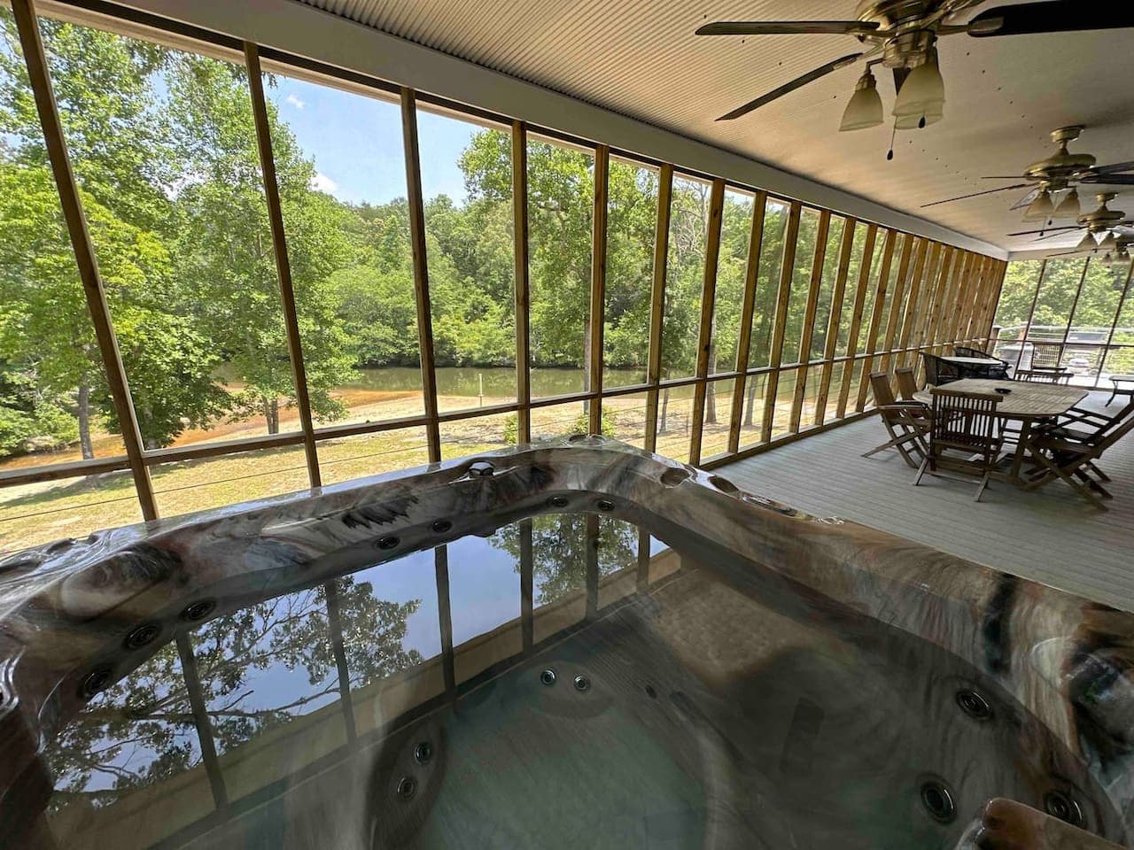 Private hot tub overlooking the river—ideal for unwinding after a day of adventure.