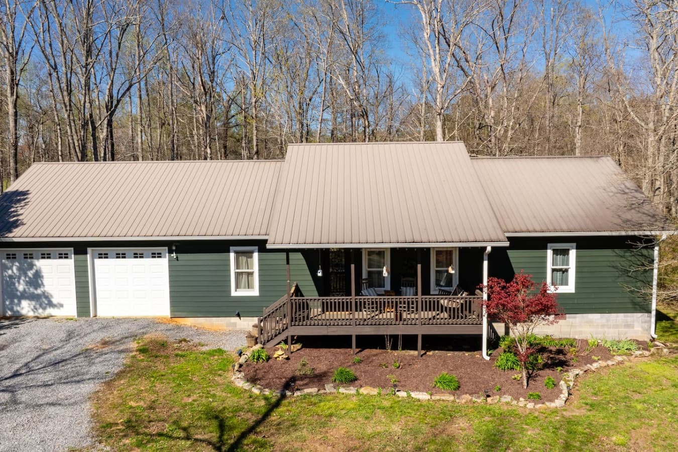 Welcome to The Bird House, where a charming front exterior and inviting entry set the tone for a warm, relaxing stay in nature’s embrace.
