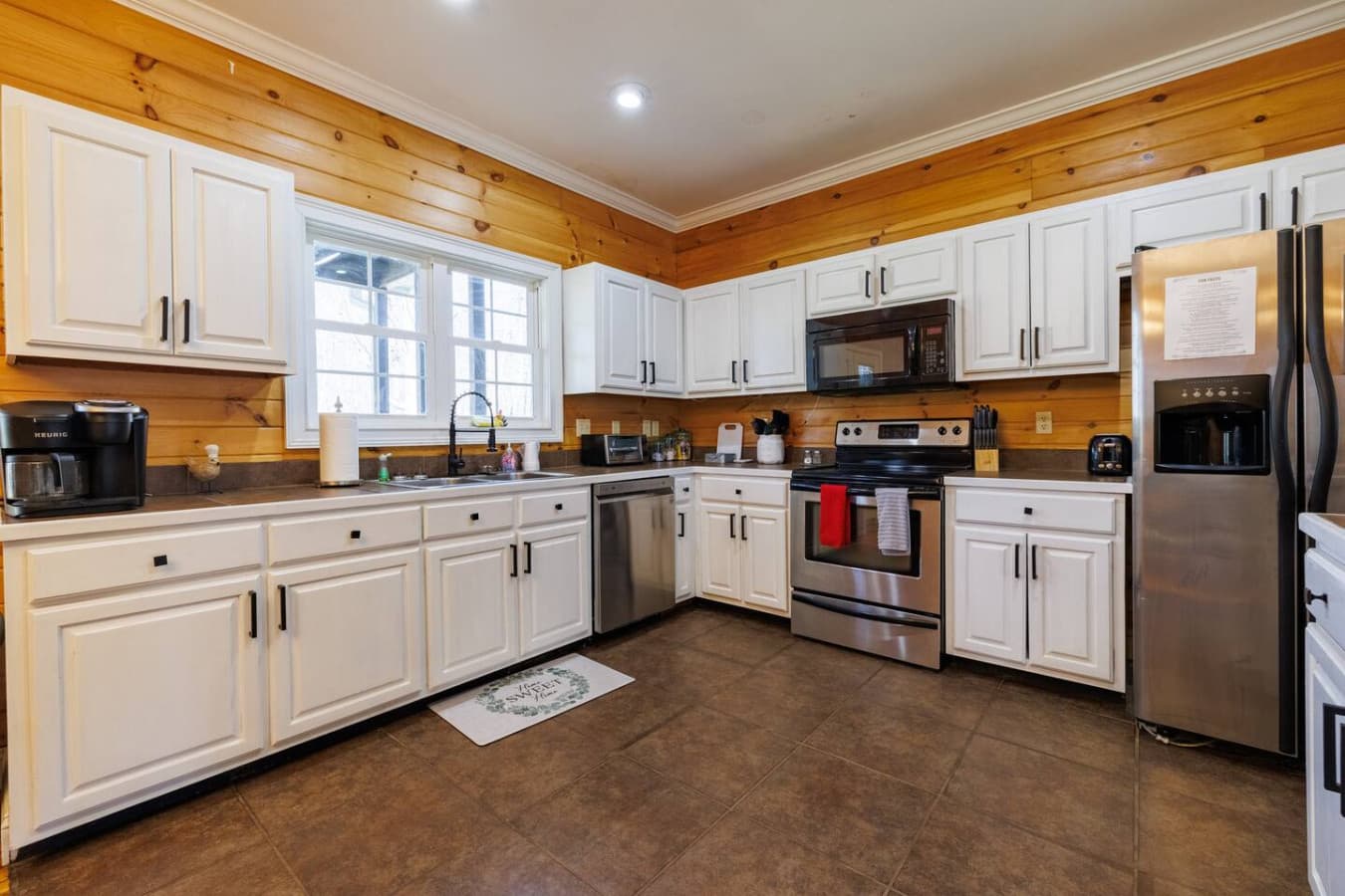 Spacious, fully equipped kitchen featuring premium stainless-steel appliances—perfect for cooking, entertaining, and creating memorable meals.