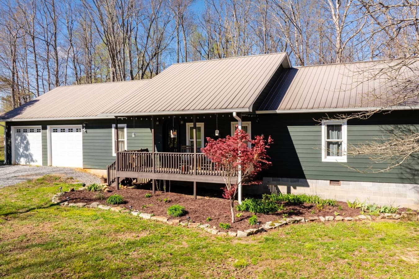 Welcome to The Bird House, where a charming front exterior and inviting entry set the tone for a warm, relaxing stay in nature’s embrace.