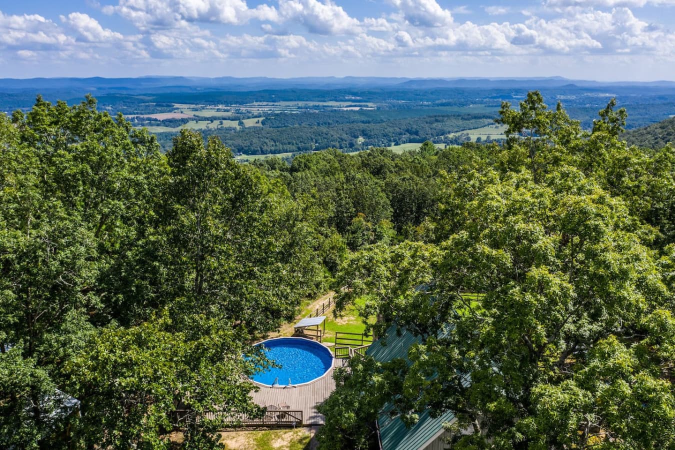 An aerial shot of the home surrounded by greenery.