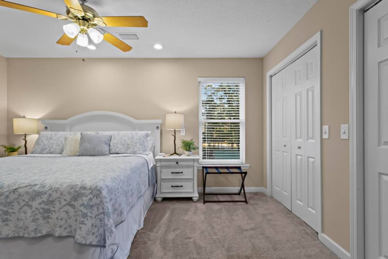 A plush king bed, warm natural light, and a private ensuite bath create the perfect retreat.