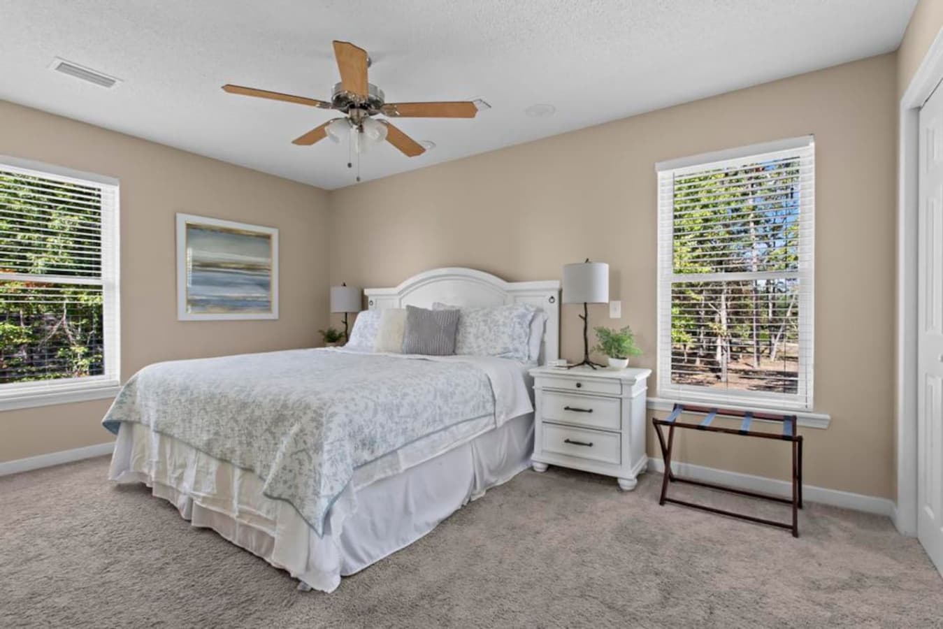 Relax in the spacious master bedroom with a king bed, natural light, and a private ensuite bathroom for added comfort.