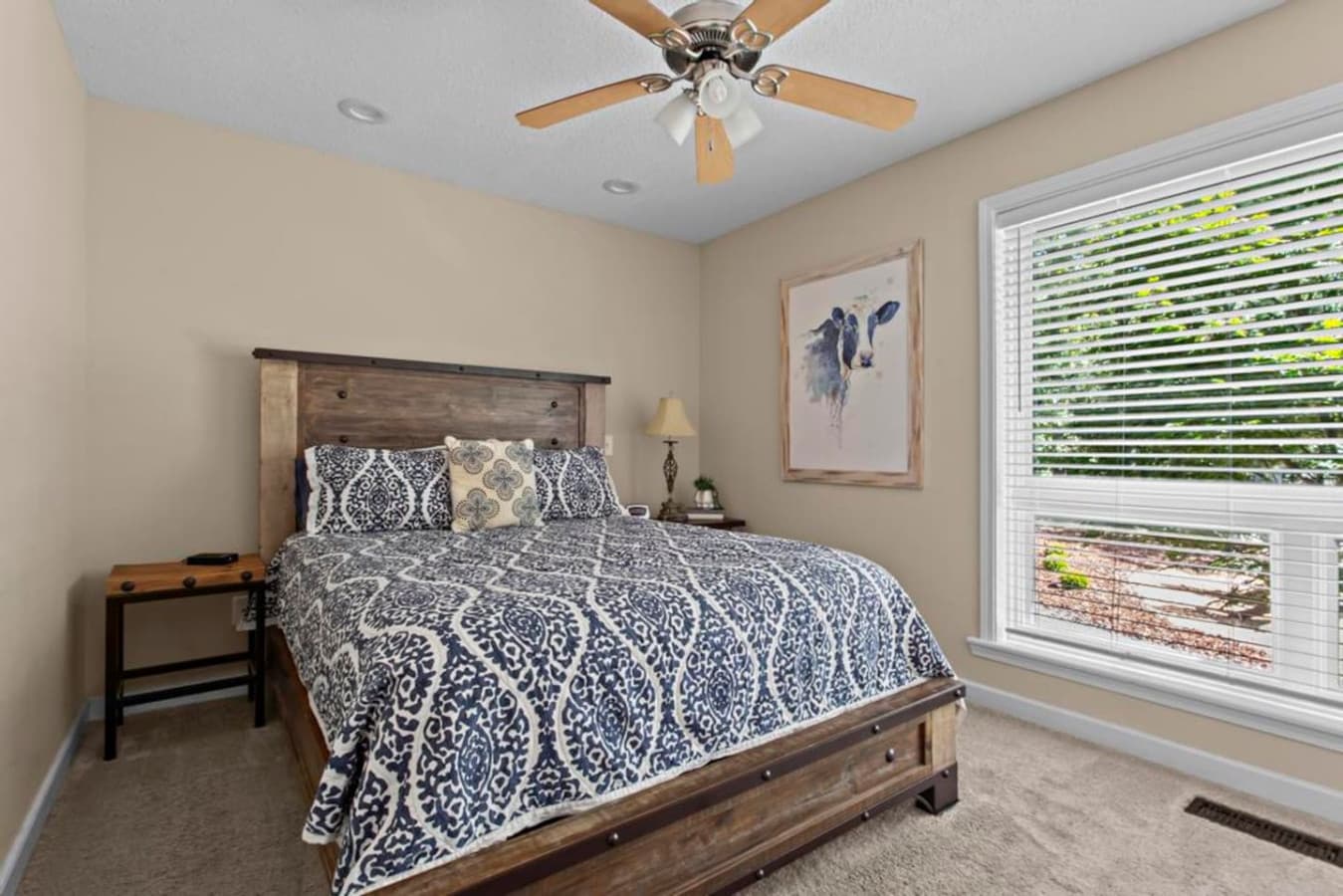 Enjoy a restful night in this peaceful bedroom with a queen bed, ample closet space, and serene surroundings.