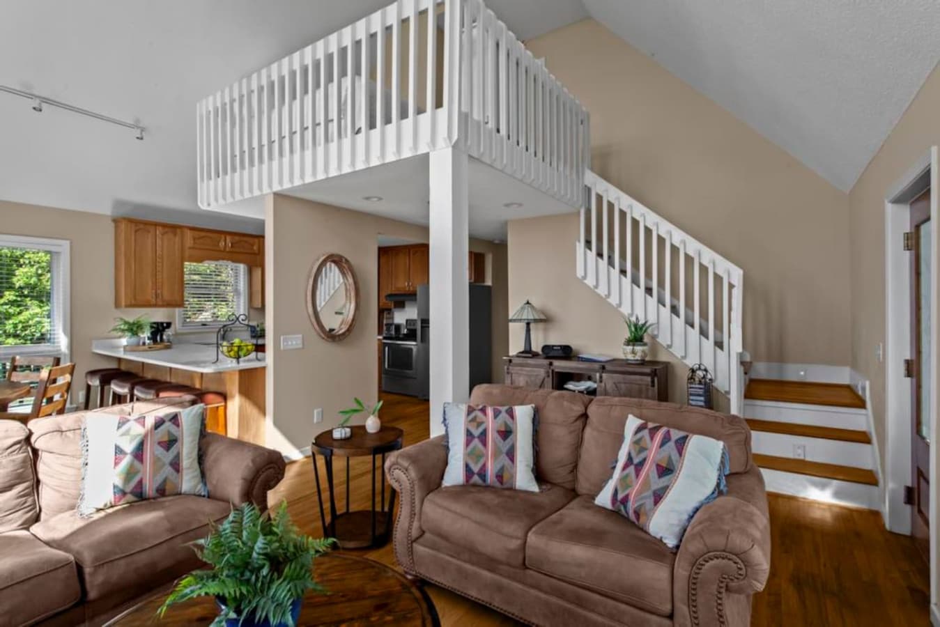 Spacious open-plan living area with comfy seating.