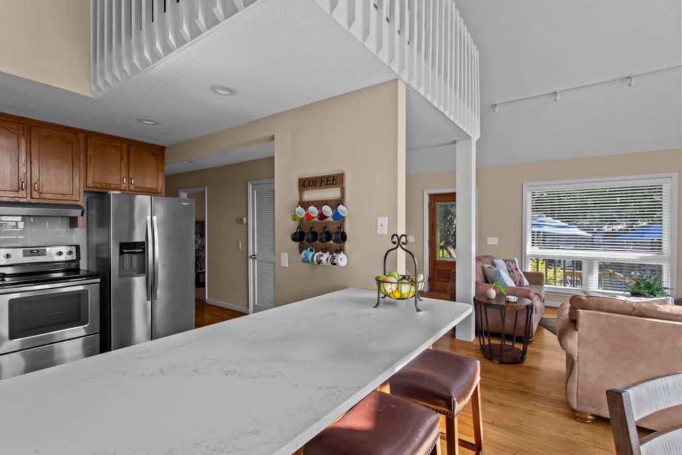 Bar stools are also available in the kitchen for extra seating.