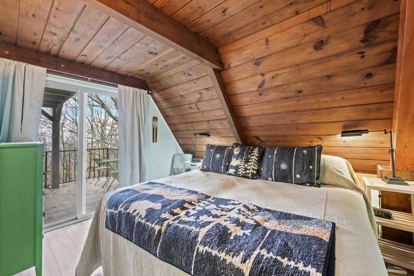 Serene master bedroom with king bed and private balcony access.